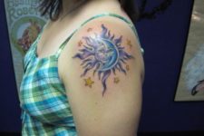 Blue and lilac tattoo on the shoulder