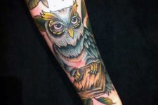 Book and owl tattoo on the hand