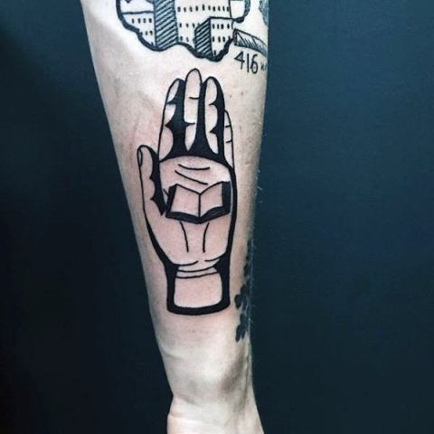 Book on palm tattoo on the hand