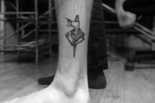 Book tattoo on the ankle