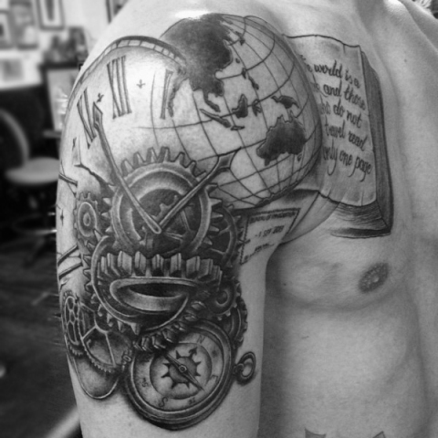 Book with globe, clock and compass tattoo on the shoulder and arm