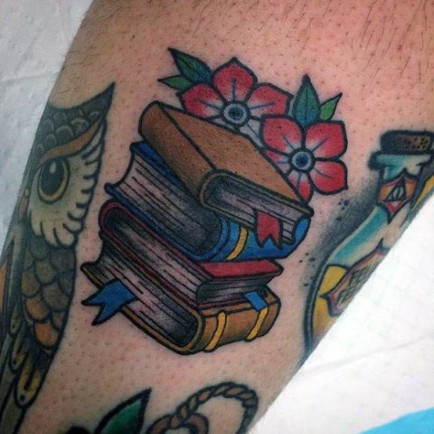 Books, flowers and owl tattoo