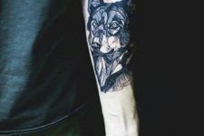 Calm wolf tattoo on the hand