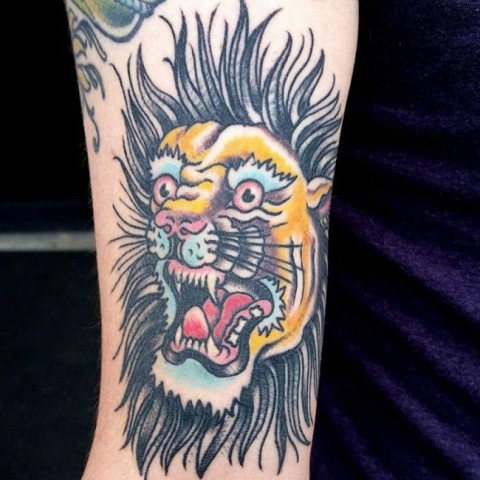 Cartoon lion tattoo
