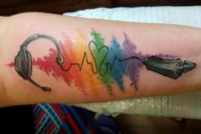 Colorful music tattoo on the hand