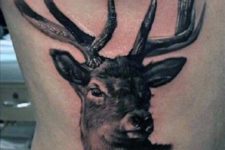 Deer head tattoo on the side