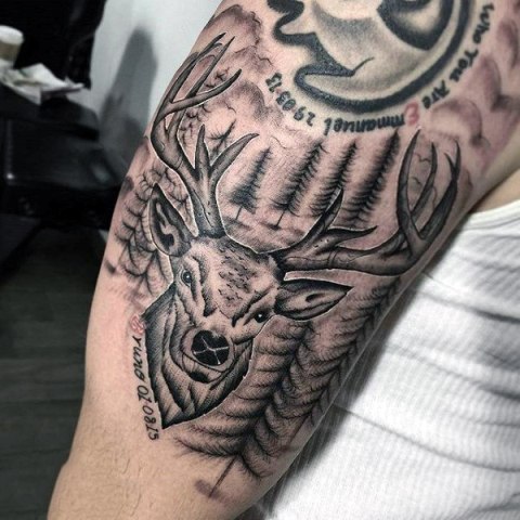 Deer tattoo with important date on the arm