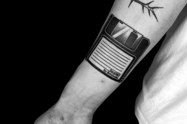 Diskette tattoo on the arm