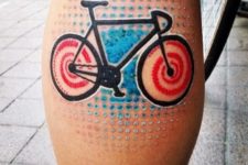 Dotted colored tattoo on the calf