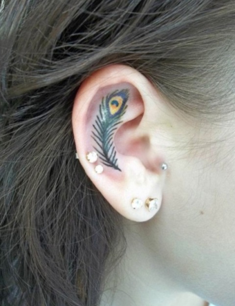 Feather tattoo on the ear