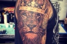 Half-sleeve lion with crown tattoo