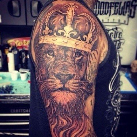 Half sleeve lion with crown tattoo