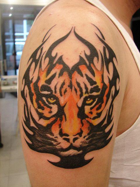 Half-sleeve tribal colored tiger tattoo