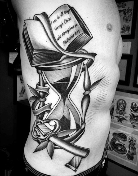 Hourglass and book tattoo on the side