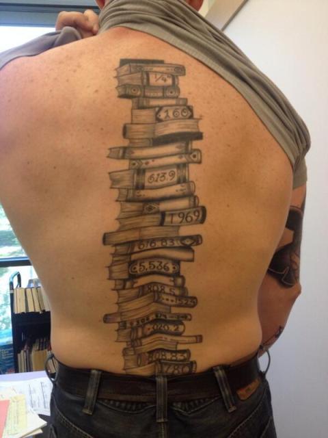 Large book tattoo on the back