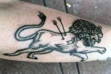 Lion with arrows tattoo on the hand