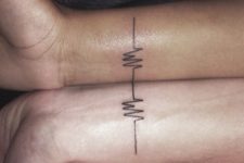 Matching tattoos on the hands