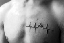 Minimalistic heartbeat and mountain tattoo
