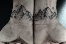 Mountain tattoos on the wrists