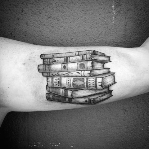 Old books tattoo on the arm
