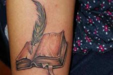 Open book tattoo on the arm