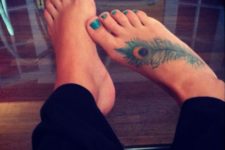 Peacock feather tattoo on the foot