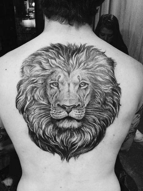Perfect lion head tattoo on the back