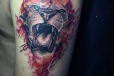 Roaring lion tattoo on the arm