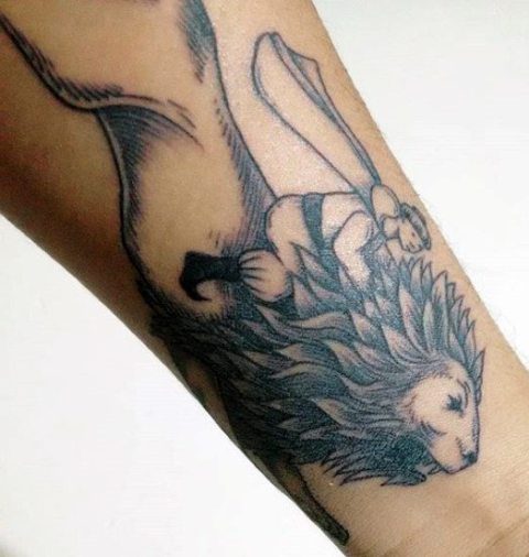Simple lion tattoo on the wrist
