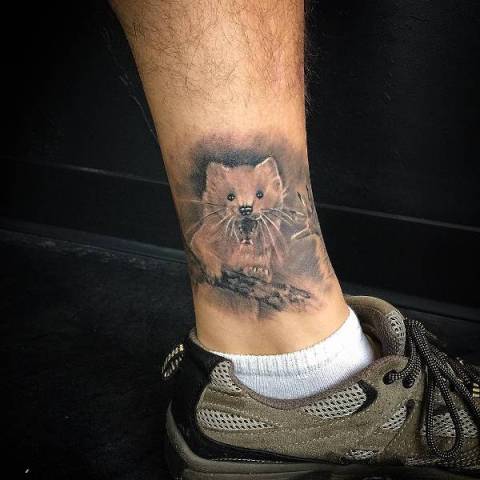 Small bear tattoo on the ankle