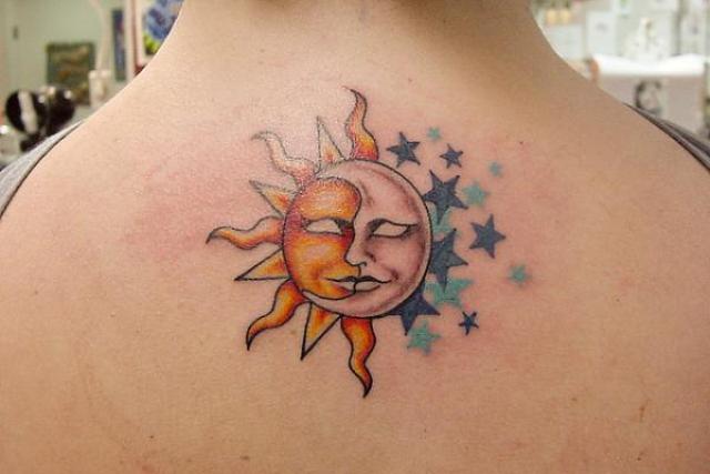 Sun and moon below neck tattoo