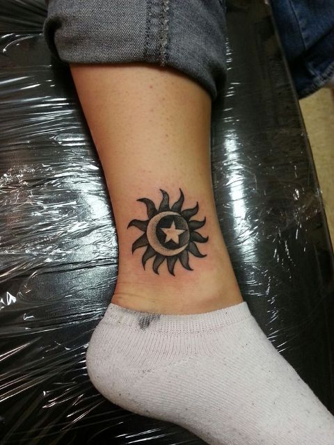 Sun and moon tattoo on the ankle
