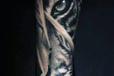 Tiger eye tattoo on the arm