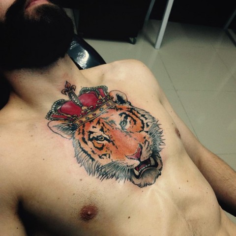 Tiger with crown tattoo on the chest