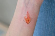 Tiny flame tattoo on the wrist