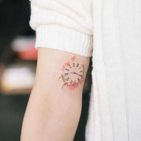 Tiny tattoo on the arm