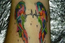 Two wings and heartbeat tattoo