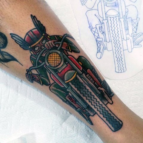 Vintage bike tattoo on the arm