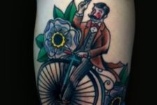 Vintage styled bicycle tattoo with flowers