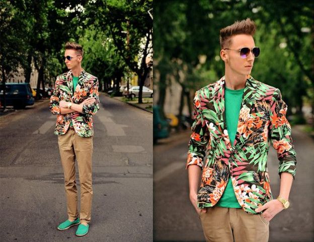 With green shirt, tropical printed blazer and camel trousers