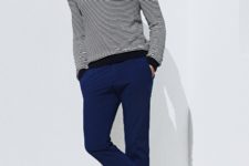 With striped shirt and navy blue pants