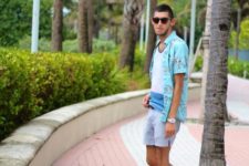 With t-shirt, turquoise shirt and gray shorts