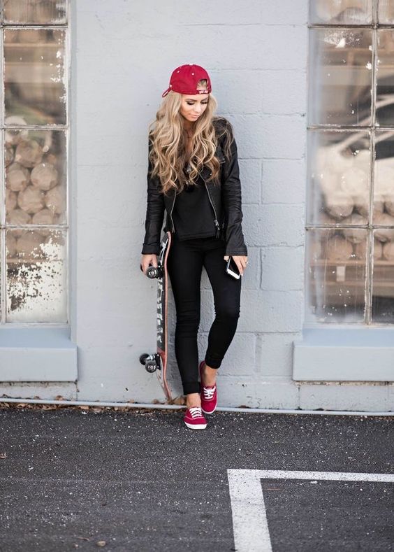 black jeans, a black tee, a black leather jacket, a red cap and red sneakers