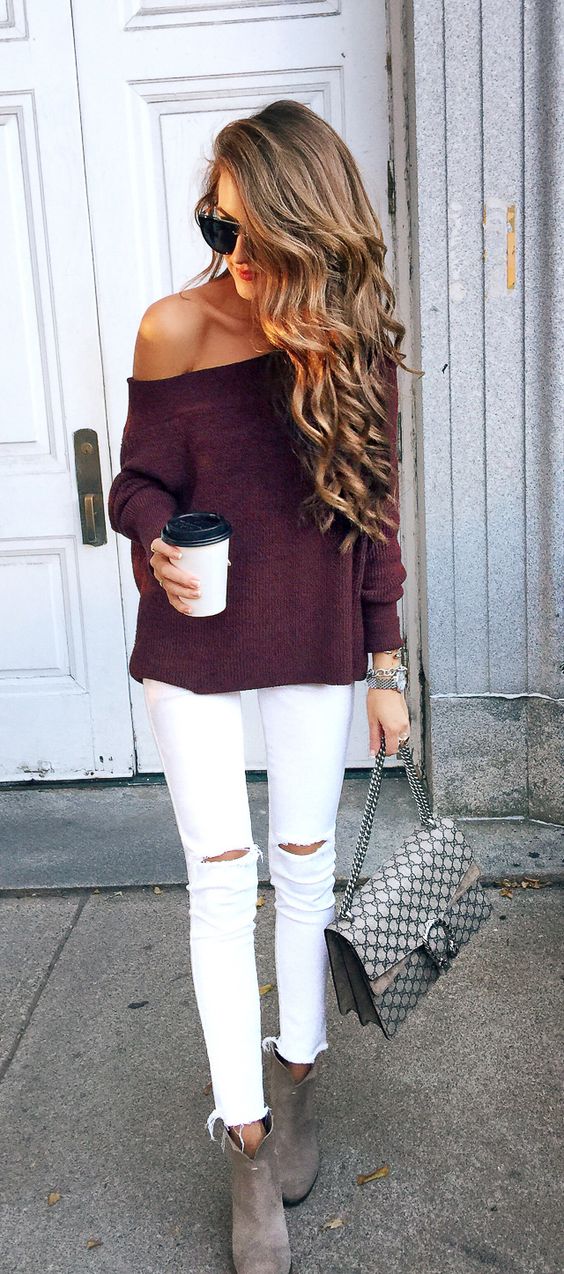 white ripped jeans, a burgundy off the shoulder sweater and grey suede booties