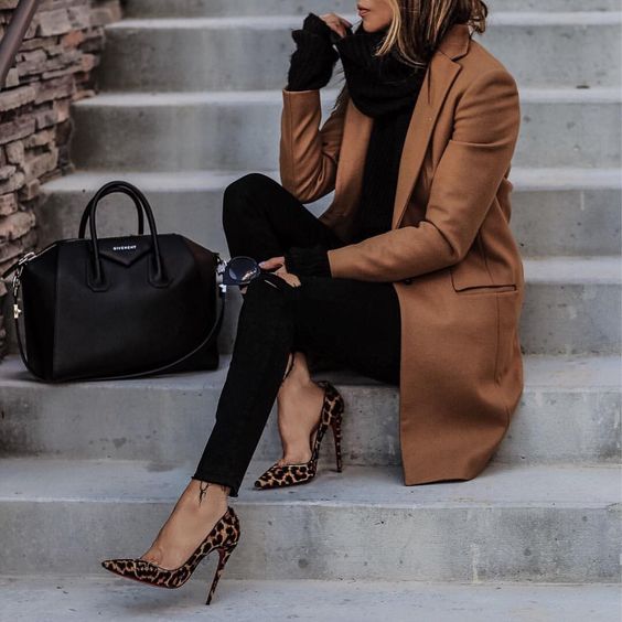 a black turtleneck sweater, black skinnies, leopard rpint shoes and a brown coat