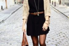 03 a mini black dress, a neutral cardigan, amber leather booties, a brown leather belt and a matching bag