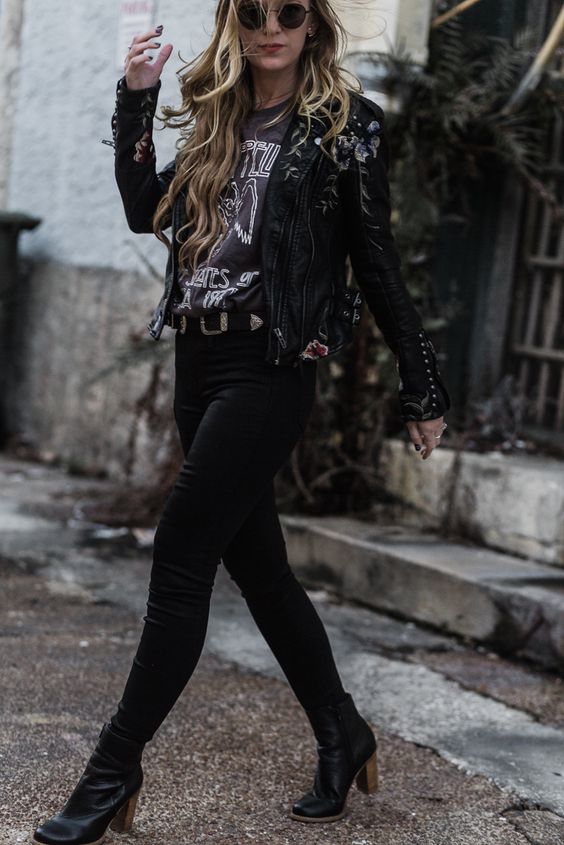 black jeans, a printed tee, a bold black leather jacket and black leather boots