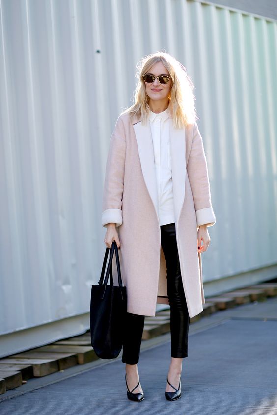 black cropped leather pants, a white shirt, black heels and a pink midi coat