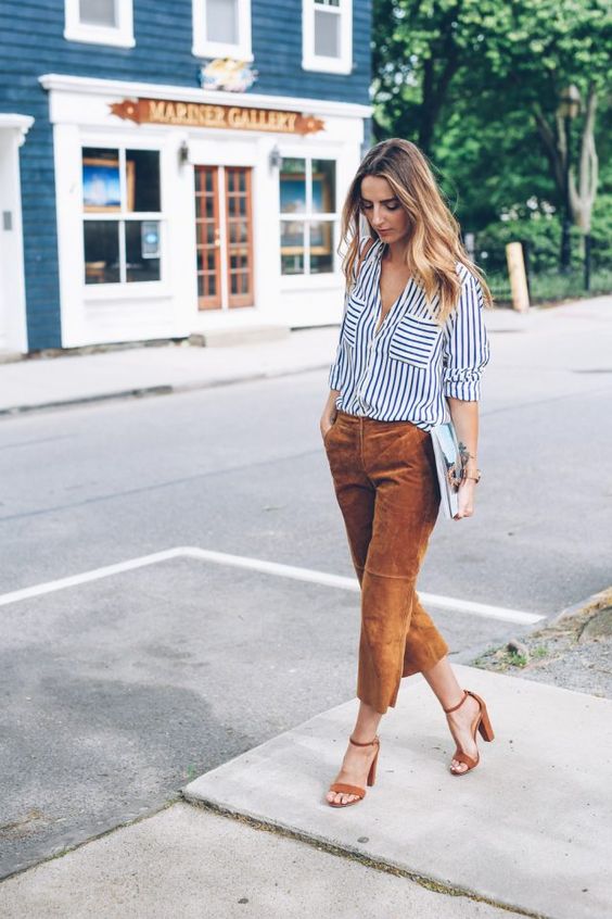 a striped black and white shirt, ocher velvet cropped pants and matching heels