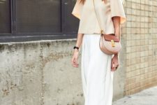 a white midi skirt, a neutral top with half sleeves, nude heels and a crossbody